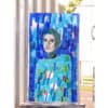 Blue stained glass mosaic art of a woman's face at Kildare Gallery.