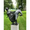 Modern bronze sculpture of two women dancing outdoors at The Kildare Gallery, Ireland.
