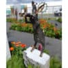 Bronze hare sculpture with binoculars at The Kildare Gallery, stunning outdoor art display.