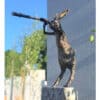 Bronze sculpture of a hare looking through a telescope, outdoor art piece at The Kildare Gallery, Ireland.
