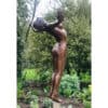 Bronze sculpture of a joyful woman in Kildare Garden, celebrating Irish contemporary art.