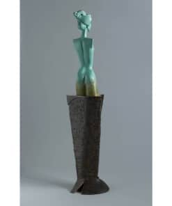 Bronze sculpture of a modern abstract female figure on a textured pedestal at The Kildare Gallery.