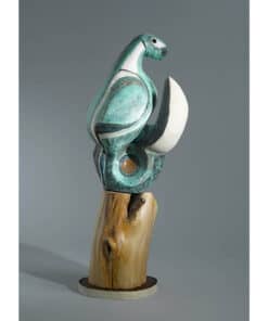 Vibrant ceramic toucan sculpture with wood base, art piece at The Kildare Gallery.