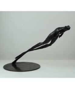 Bronze sculpture of a swimmer in mid-dive, displayed at The Kildare Gallery, showcasing contemporary art and dynamic movement.