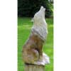 Stone sculpture of a howling wolf in the garden at The Kildare Gallery, showcasing contemporary Irish art.