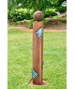 Spiked metallic sculpture on wooden pedestal at The Kildare Gallery garden, featuring contemporary outdoor art installations.