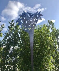 Intricate butterfly sculpture artwork at The Kildare Gallery, featuring modern metal art in a garden setting.