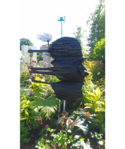 Contemporary black metal sculpture in Kildare Gallery's garden setting.