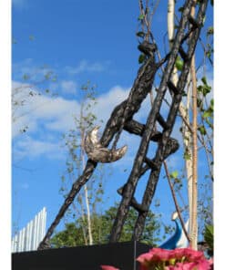 Vibrant outdoor sculpture at The Kildare Gallery with blue sky and greenery in background.