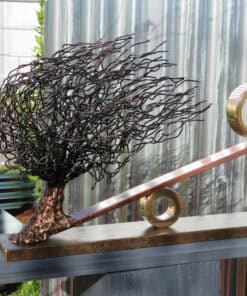 Intricate iron sculpture of a tree with artistic rings at The Kildare Gallery, showcasing contemporary art and sculpture exhibitions.