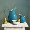 Vintage blue ceramic pitcher set with pears and bowl on rustic white table, still life art.