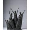 Intricate bronze sculpture of five joyful figures with outstretched arms at The Kildare Gallery.