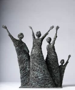 Bold metal sculpture of three figures with raised arms at Kildare Gallery, Ireland.
