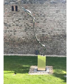 Contemporary abstract metal sculpture displayed outdoors at The Kildare Gallery, showcasing modern art in a garden setting.