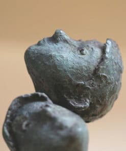 Ancient stone sculpture, artwork by The Kildare Gallery, showcasing historical craftsmanship and Irish art.