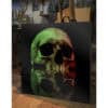 Skull art print on canvas at The Kildare Gallery in Ireland, modern skull artwork with colourful lighting, displayed in an artist's studio.