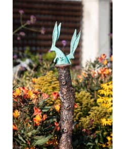 Vivid metal rabbit sculpture in a colourful garden setting at The Kildare Gallery.