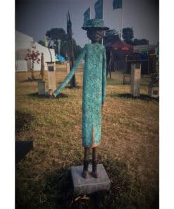 Wrought iron sculpture of a woman with a hat at The Kildare Gallery outdoor exhibition.