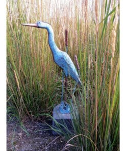 Metal heron sculpture in tall grass at The Kildare Gallery.