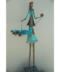 Delicately crafted metal sculpture of a stylish woman with flowers, showcasing fine artistry at The Kildare Gallery.