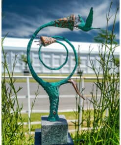 Elegant metal sculpture featuring a bird, displayed outdoors at The Kildare Gallery, Ireland.