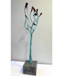 Intricate metal sculpture of a bird visiting a stylised tree, displayed at The Kildare Gallery in Ireland.