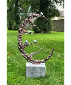 Bold copper crescent moon sculpture with blue bird accents outdoor garden art Kildare Gallery.
