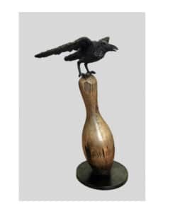 Rustic bird sculpture perched on a wooden base, displayed at The Kildare Gallery in Ireland.