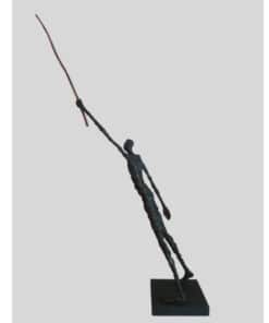 Slender abstract sculpture of a human figure on a black base.