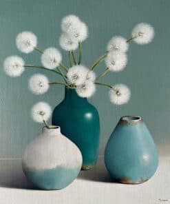 Delicate dandelion puff flower arrangement in turquoise ceramic vases at The Kildare Gallery.