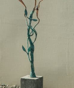 Vibrant metal sculpture of a hummingbird and flowers outside The Kildare Gallery, showcasing contemporary garden art and outdoor sculptures.