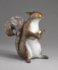 Elegant squirrel sculpture made of marble, showcasing fine craftsmanship at The Kildare Gallery.