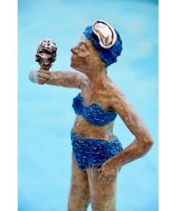 Vibrant ceramic sculpture of a woman in a blue bikini holding an ice cream against a light blue background.