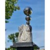 Shiny metal spheres sculpture on stone base at The Kildare Gallery, Irish contemporary outdoor art.