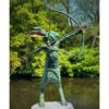 Bronze statue of an archer with a bow and arrow, set in lush green outdoor environment.