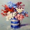 Red, blue, and white flower bouquet painting in a rustic vase at The Kildare Gallery.