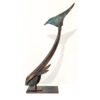 Intricate bronze sculpture of a bird with a curved neck, on display at The Kildare Gallery.