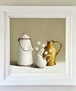 Vintage ceramic jugs with white flowers displayed at The Kildare Gallery.
