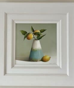 Lemon still life painting in white frame, showcasing vibrant lemons and green leaves in a modern art style.