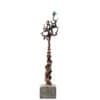 Abstract bronze sculpture of a twisted tree on a concrete base, contemporary art piece.