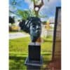 Bronze sculpture of a woman's head at The Kildare Gallery outdoor exhibition, showcasing contemporary art.