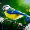 Vibrant painted blue tit bird on blossom branch against green background, artwork from The Kildare Gallery.
