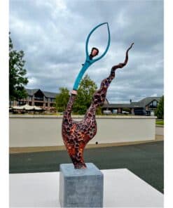 Vibrant outdoor sculpture at The Kildare Gallery featuring abstract art with textured metal and colourful elements.