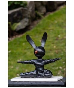 Black rabbit sculpture artwork at The Kildare Gallery, outdoor art piece, modern sculpture in garden setting.