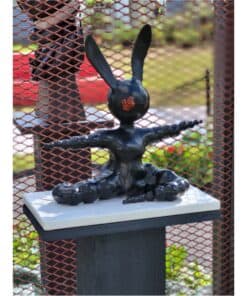 Contemporary black bunny sculpture with elongated ears, displayed outdoors at The Kildare Gallery.