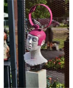 Colourful bust sculpture with pink hair and a mirror headpiece at The Kildare Gallery in Ireland.