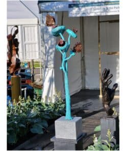 Blue abstract sculpture with butterfly accents at The Kildare Gallery.