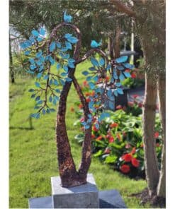 Vibrant blue leaf sculpture artfully displayed outdoors at The Kildare Gallery garden.