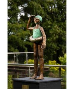 Bronze sculpture of a girl with green hair and swim ring, outdoor art at The Kildare Gallery, Ireland.