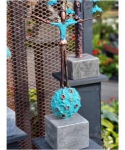 Fibre optic art sculpture featuring a figure balancing on a spherical object with eye-like details.